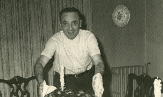 Jack Fox serving dinner, circa 1950s, Jewish Neighborhood Voices collection in the JHC archive.