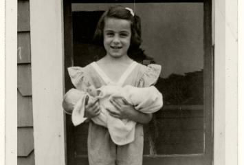 Elaine (Kellem) Baskin with doll, 1942, image courtesy of Elaine Baskin.