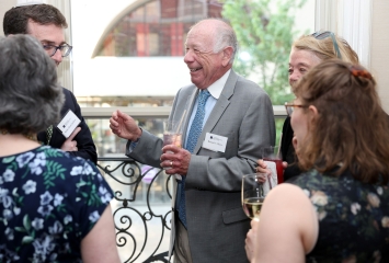 JHC Benefit Dinner | Talking and laughing group