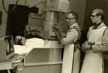 Doctors testing an x-ray machine at Jewish Memorial Hospital, circa 1960s.
