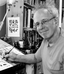 Dan Mazur Dan Mazur posing at his drawing desk in black and white with a pen in hand