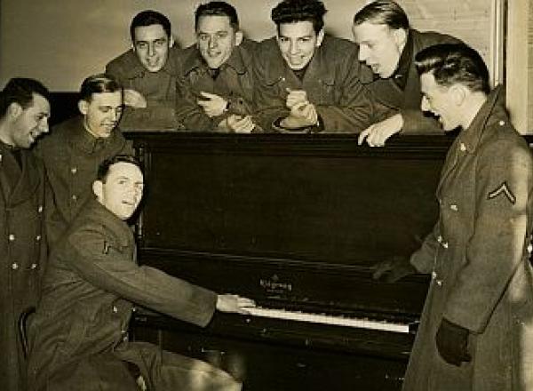 Soldiers playing piano