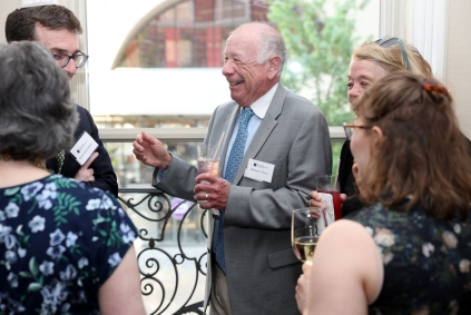 JHC Benefit Dinner | Talking and laughing group